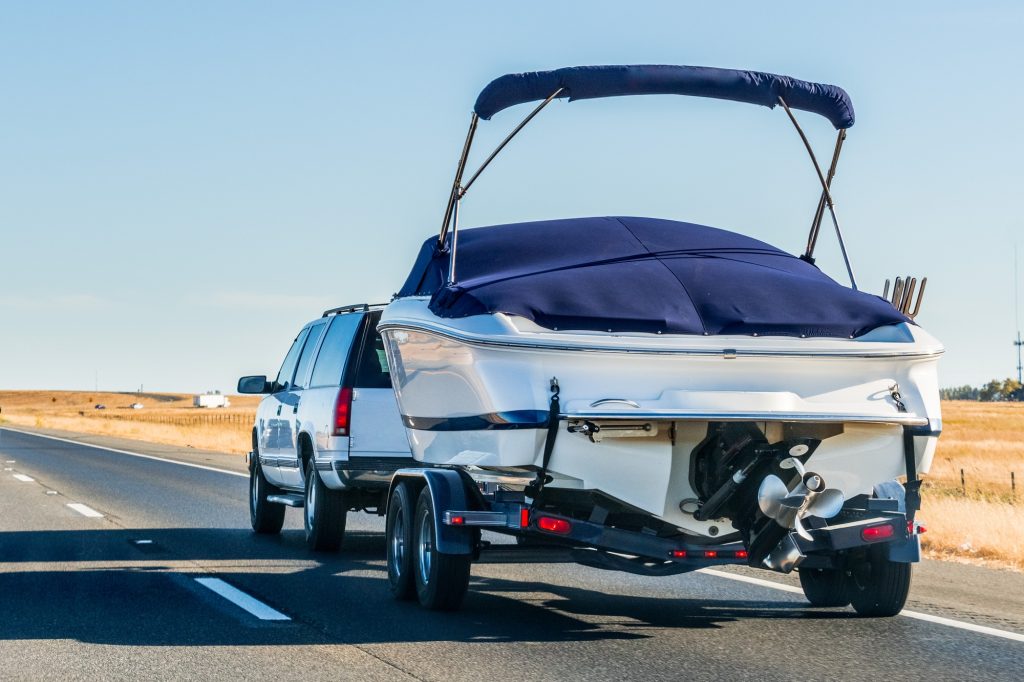 Truck towing a boat on the interstate, California